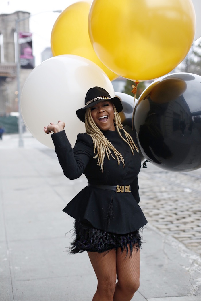 2  claire sulmers fashion bomb daily An Ashaka Givens Hat, Plutocracy Jacket, and a Robert Rodriguez Feather Skirt big large balloons black white gold