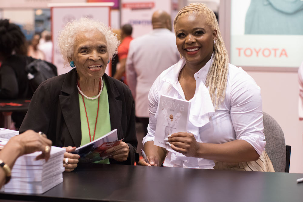 centered-signing-copies-of-the-bomb-life-at-the-toyota-booth-at-the-national-urban-league-wearing-luxe-protocol-claire-sulmers-fashion-bomb-daily-jpg